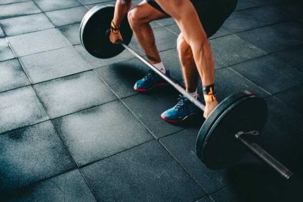 person-holding-barbell-841128 person-holding-barbell-841128